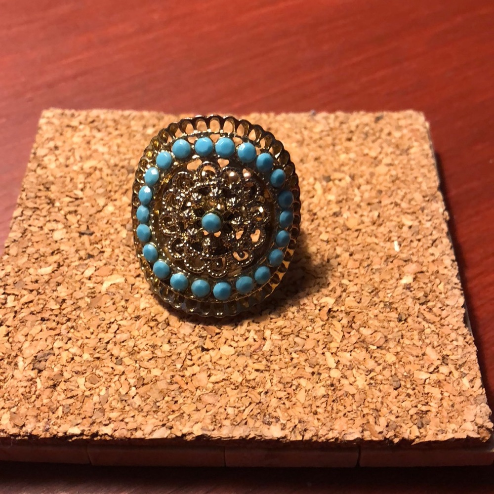 Gold color stretch ring with turquoise color beads